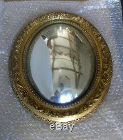 Ancien miroir de sorcière ovale, cadre en bois doré, bon état