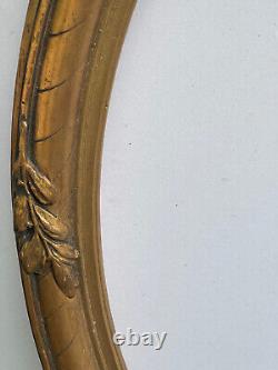 Cadre Médaillon ovale en bois et stuc doré, noeud style Louis XVI