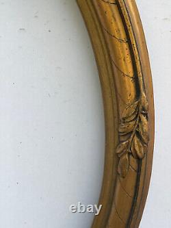 Cadre Médaillon ovale en bois et stuc doré, noeud style Louis XVI