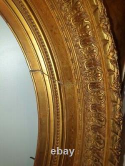 Cadre médaillon de style Louis XVI en bois doré à vue ovale XIXème siècle 53x43