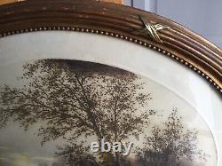 Cadre ovale en bois doré 52x70 avec aquatinte début XXème Paysage