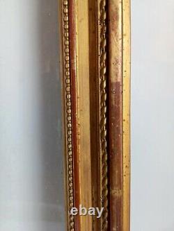 Grand cadre XIXe style Louis XVI bois et stuc doré