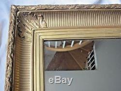 Miroir dans cadre en bois doré XIXème