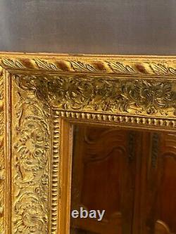 Miroir large cadre en bois doré de style Régence