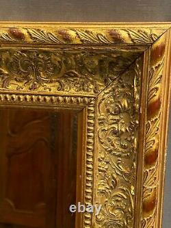 Miroir large cadre en bois doré de style Régence