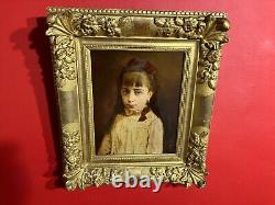 Portrait de petite fille signé et daté de 1884, très beau cadre en bois doré