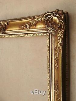 Superbe et imposant cadre en bois doré de style Louis XV format 12 P environ